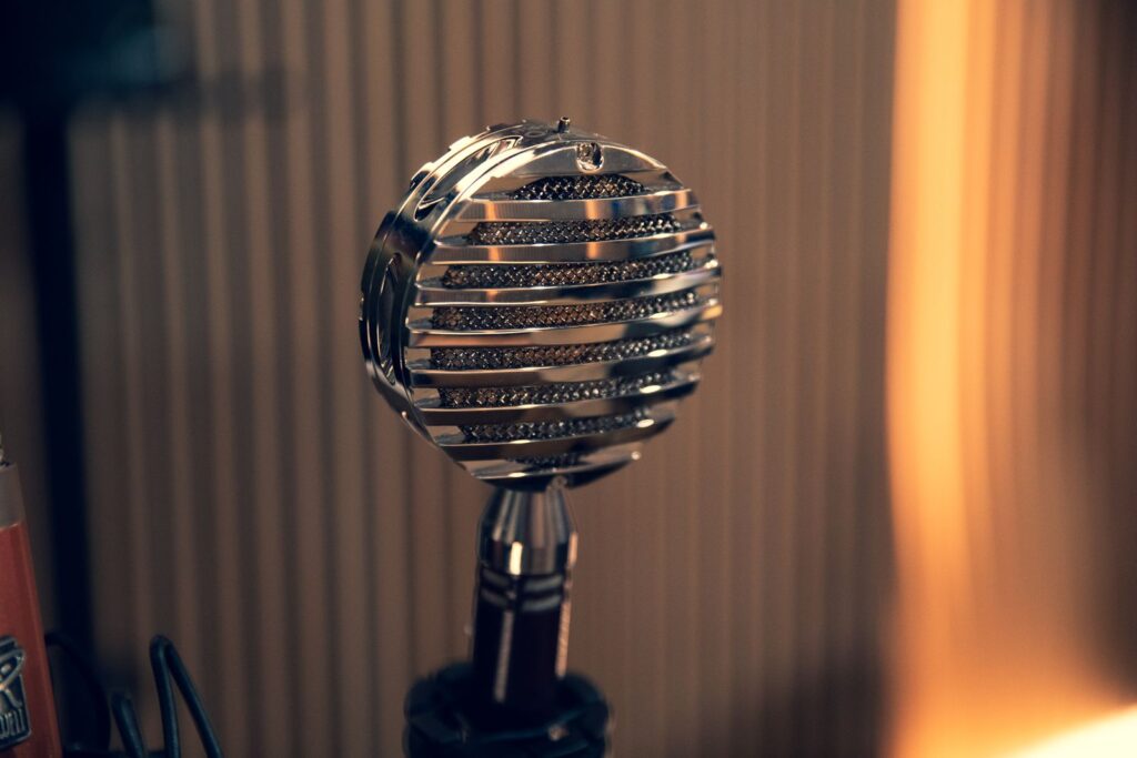 Retro chrome microphone in a warmly lit studio
